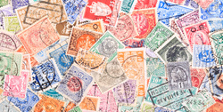 old postage stamps from various countries as background