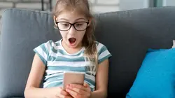 A child looking at a phone