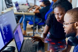 Two people working in a computer