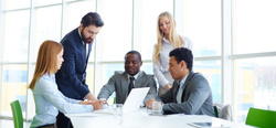 businesspeople working as team with laptop