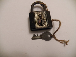 A photo of an old lock with key
