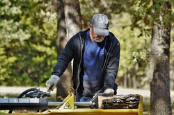 Man Using Log Splitter