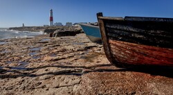 Fishing boats near Portland Bill Light House on the Dorset coast