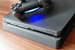A Sony PlayStation 4 with controller