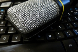 Podcast microphone on a computer keyboard