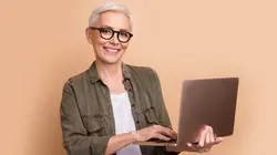 woman holding laptop