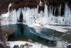 Mountain springs form ice waterfall