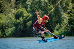 A cable skier, person, water sports