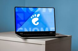 GNOME logo on the laptop screen