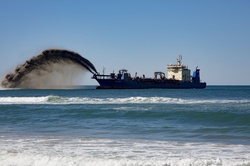 Ship blasting sand back to the coast in Queensland Australia