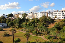 Seaside hotels on a summer day with green gardens