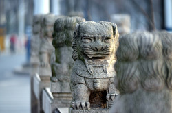 Foo dog ornaments on a bridge