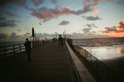 Picture of pier activity at sunset, Seal Beach, California, USA