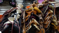 Stacks of Leather Crafted Saddles
