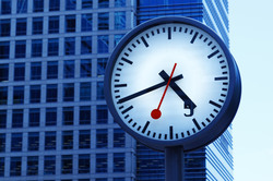 Analogue blue clock with red second hand