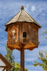 Traditional wooden dovecote against sky