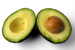 Avocado sliced in half with the core