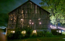 Rustic night time party barn with lights