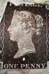 A magnified photo of Worlds first adhesive postal stamp issued in Britain on 1st May 1840 bearing the imprint of the then British monarch Queen Victoria.