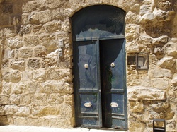 Antique blue door in Old City in Jerusalem