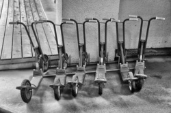 Kid scooters in a rack outside a school in Shibuya, Tokyo.