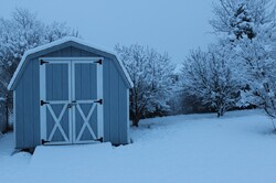 Snowy backyard with shed in blue pearl finish