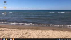 The default background on the Maple Linux 1.4 desktop appears to be a scene taken from Lake Ontarioâs or Lake Eries Canadian side