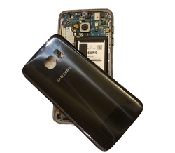 Black Galaxy S7 Smartphone with back removed resting on the device