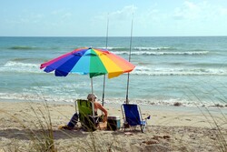 Fisherman resting on the beach, Florida, USA
