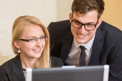 Business People On A Computer