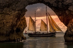 Beautiful sunset with Ship, Durdle Door, United Kingdom