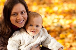 Mom and child in park in autumn