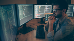 a working person infront of computers