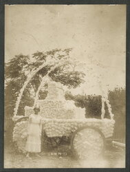 A woman stands before a decorated carriage, Juneteenth celebrations in Corpus Christi, Texas