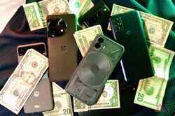 several Android devices and dollar bills