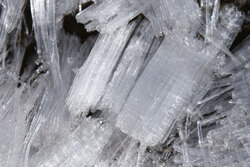 These form in higher altitudes when moisture in the ground rises back out of the Earth slowly, basically just like a reverse icicle.